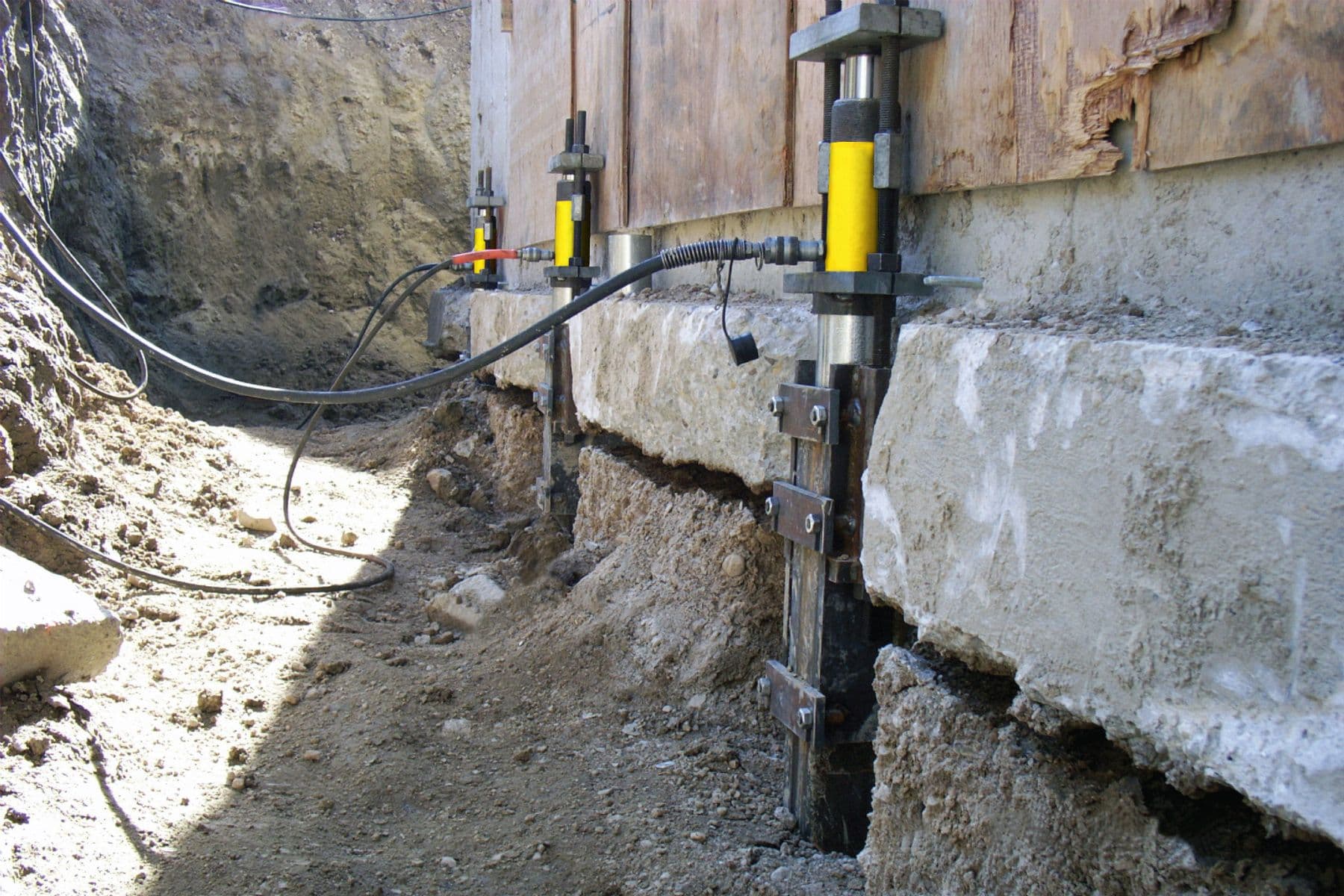 Push piers on a house foundation.